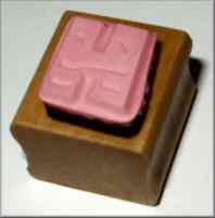 Wood mounted rubber stamp